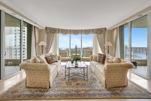 living room with a water view and expansive windows