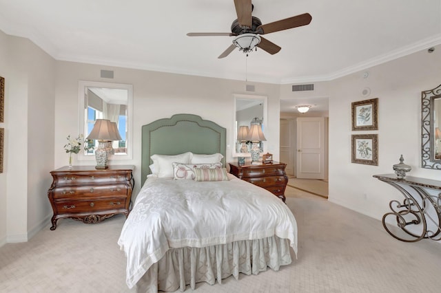 bedroom with ceiling fan, crown molding, and light carpet