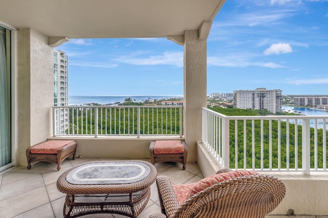 balcony featuring a water view