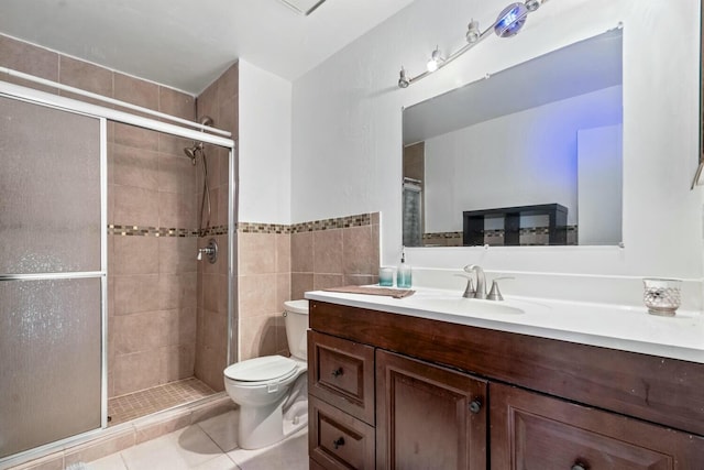 bathroom featuring walk in shower, tile patterned floors, vanity, and toilet