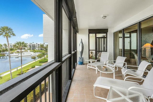 balcony featuring a water view