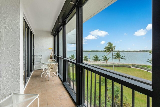 balcony featuring a water view