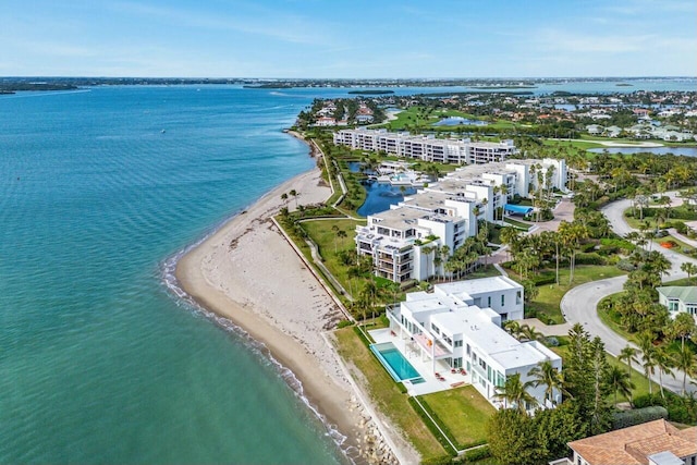 bird's eye view with a water view and a beach view