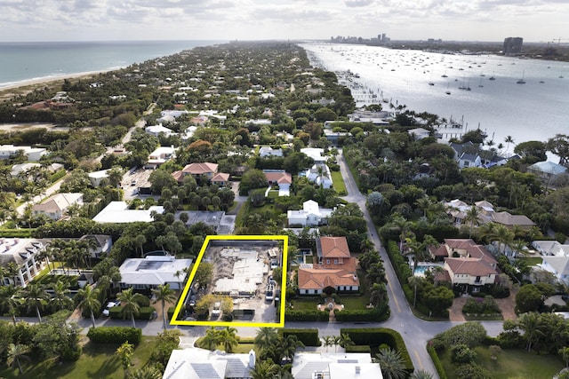 drone / aerial view featuring a water view and a residential view