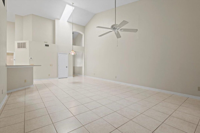 unfurnished living room featuring high vaulted ceiling, ceiling fan, and light tile patterned flooring