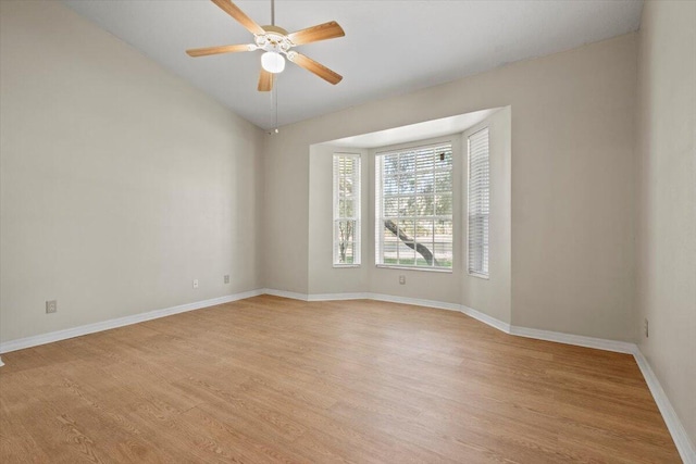 unfurnished room featuring ceiling fan, vaulted ceiling, and light hardwood / wood-style flooring