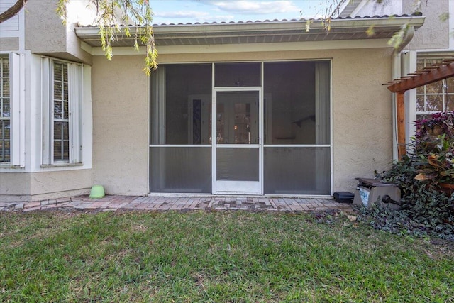 rear view of property with a lawn and a pergola