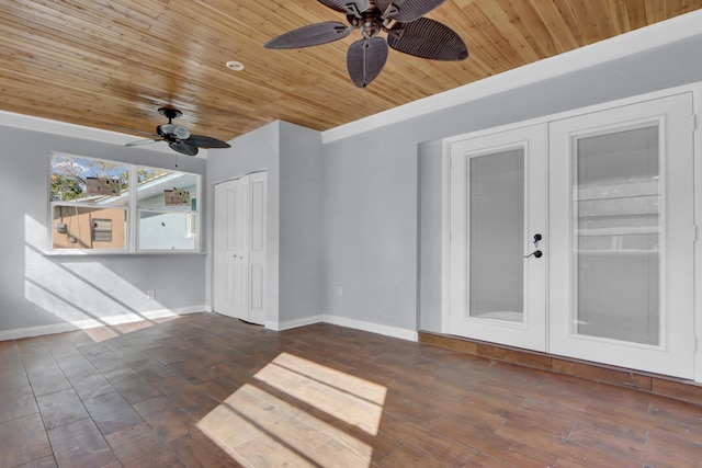 empty room featuring french doors, wood ceiling, and dark hardwood / wood-style floors