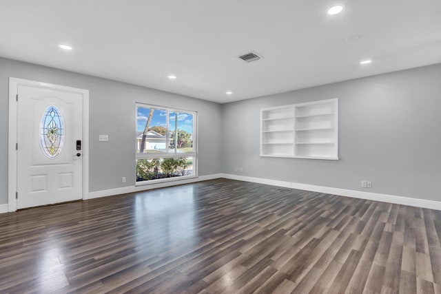 foyer with dark hardwood / wood-style flooring