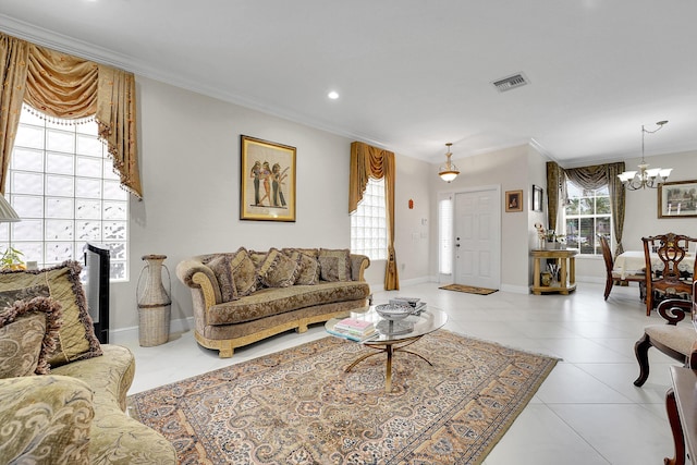 tiled living room with ornamental molding and a chandelier