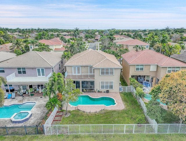 view of pool with a lawn and a patio