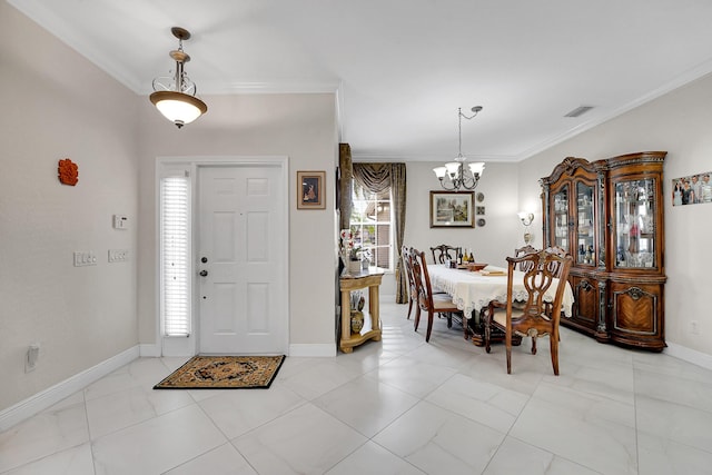 foyer with crown molding and a notable chandelier