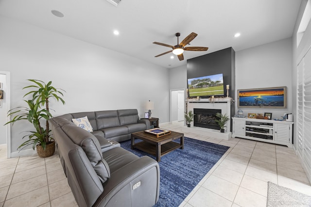 tiled living room featuring ceiling fan