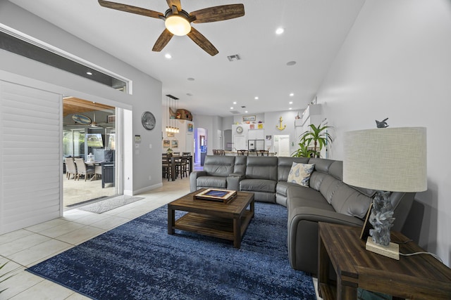 tiled living room with ceiling fan