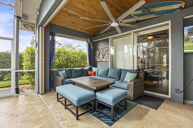 sunroom / solarium featuring wooden ceiling, lofted ceiling, and ceiling fan