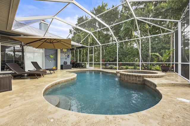 view of swimming pool featuring a patio area, glass enclosure, and an in ground hot tub