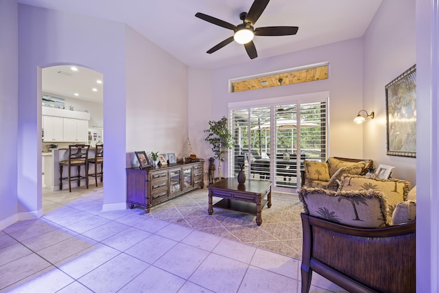 living room featuring ceiling fan and light tile patterned flooring