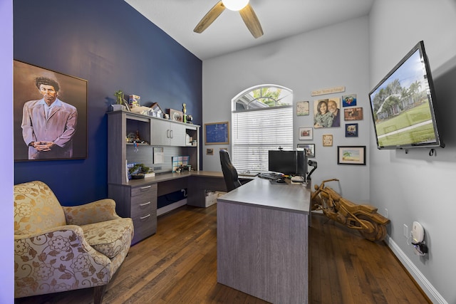 home office with ceiling fan, dark hardwood / wood-style flooring, and lofted ceiling