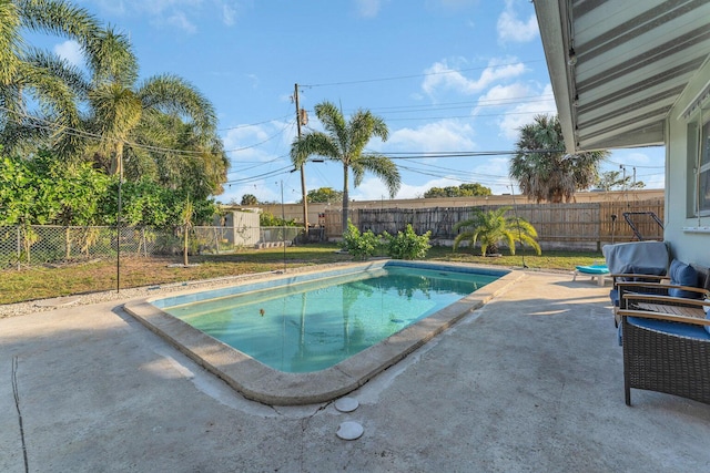 view of swimming pool featuring a patio area