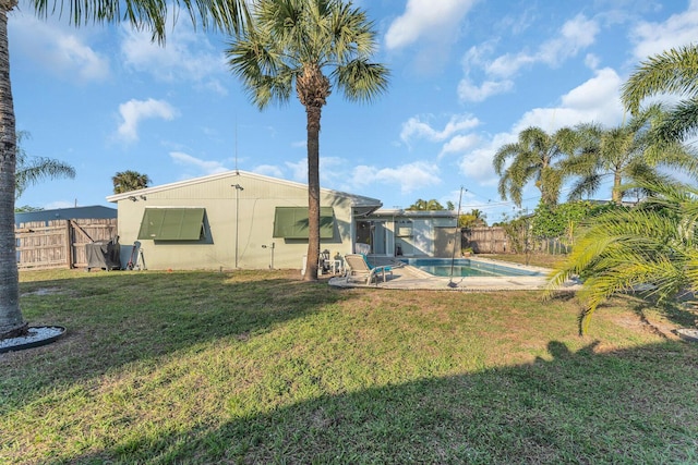 view of yard featuring a fenced in pool and a patio area