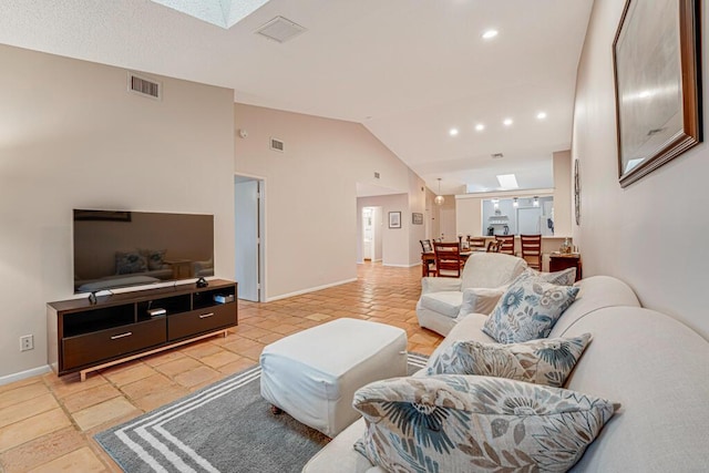 tiled living room with vaulted ceiling