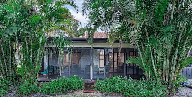 view of front facade with a sunroom