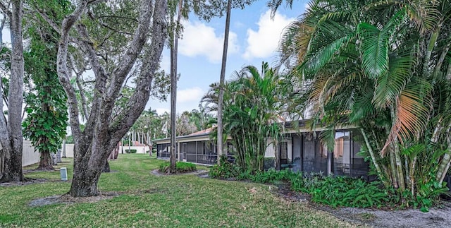 view of yard with a sunroom