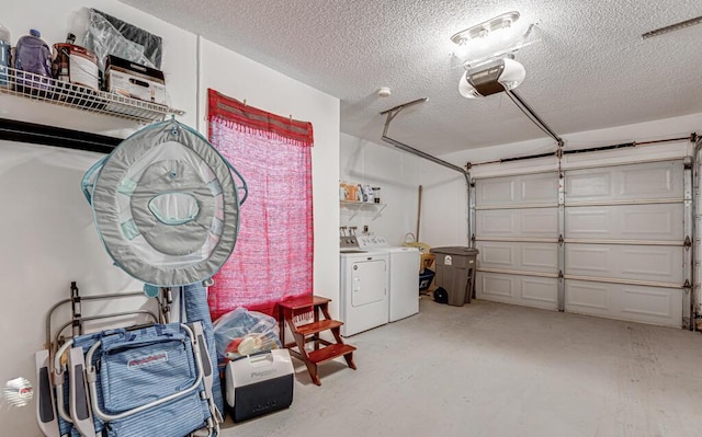 garage with separate washer and dryer and a garage door opener