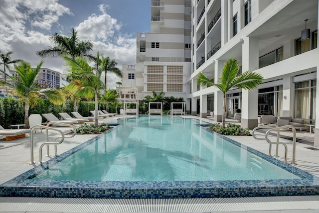 community pool with a patio area