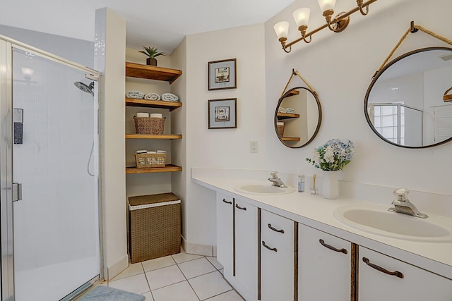 full bath with a stall shower, tile patterned flooring, a sink, and double vanity