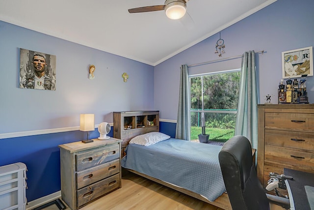 bedroom featuring lofted ceiling, light wood-style flooring, and a ceiling fan