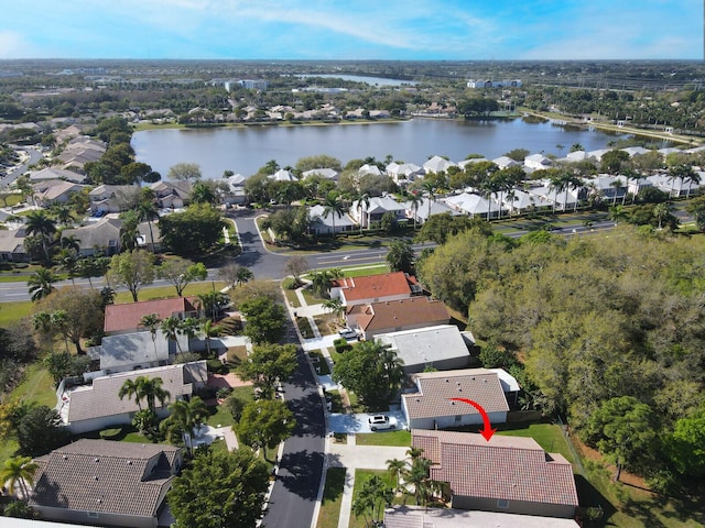 aerial view with a residential view and a water view