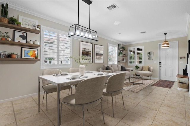 tiled dining space featuring ornamental molding