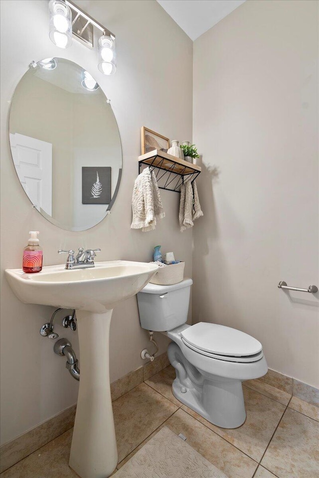 bathroom featuring tile patterned floors and toilet