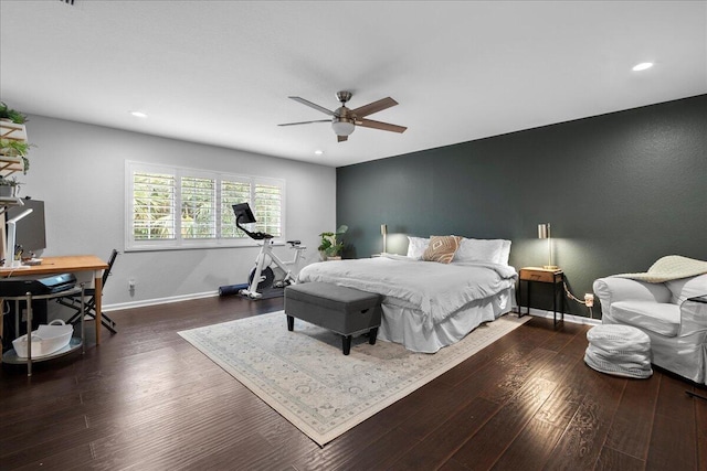 bedroom with dark hardwood / wood-style floors and ceiling fan