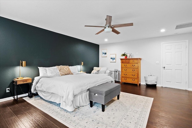 bedroom featuring dark wood-type flooring and ceiling fan