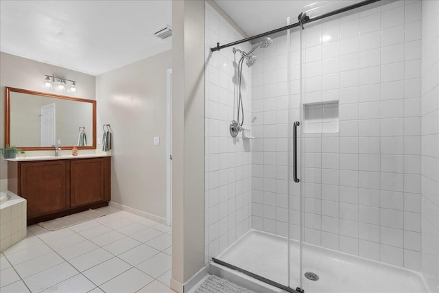 bathroom with walk in shower, tile patterned floors, and vanity