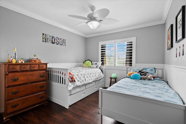 bedroom with dark hardwood / wood-style flooring, crown molding, and ceiling fan