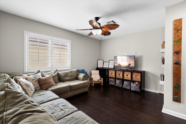 living room with ceiling fan and dark hardwood / wood-style flooring