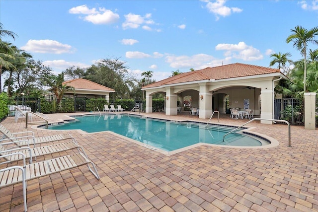 view of pool featuring a patio