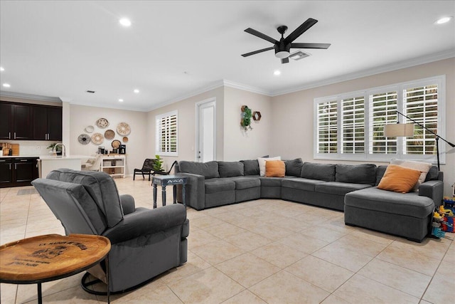 tiled living room with crown molding and ceiling fan