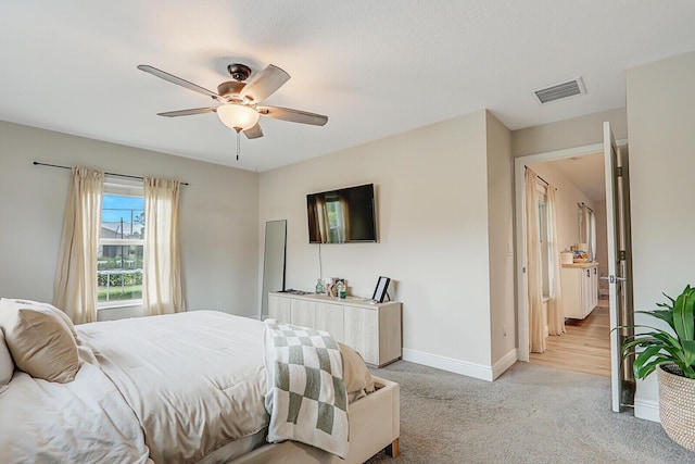 bedroom featuring ceiling fan and light colored carpet