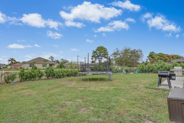 view of yard with a trampoline