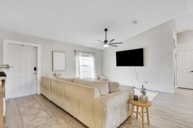 living room featuring ceiling fan and light hardwood / wood-style flooring