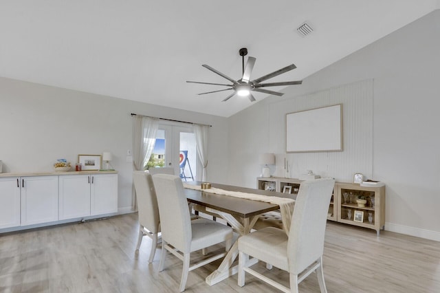 dining space with lofted ceiling, light wood-type flooring, ceiling fan, and french doors