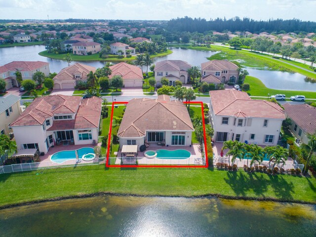 drone / aerial view with a water view