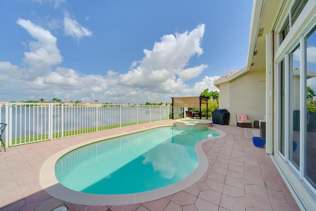 view of swimming pool with an in ground hot tub, a patio, and a water view