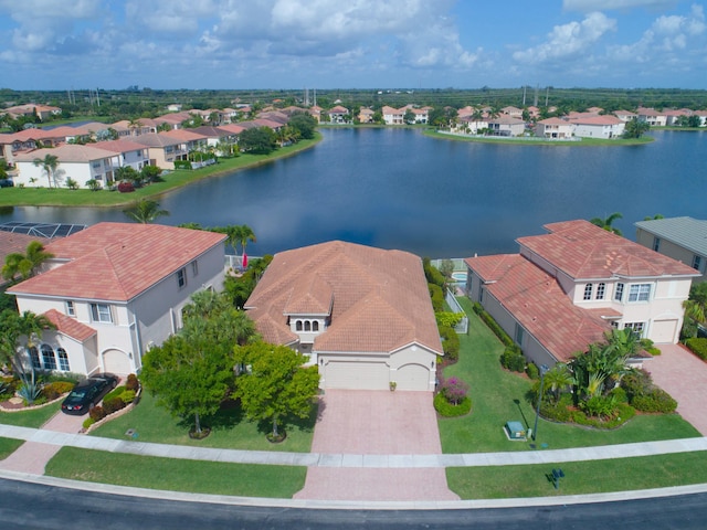 birds eye view of property with a water view