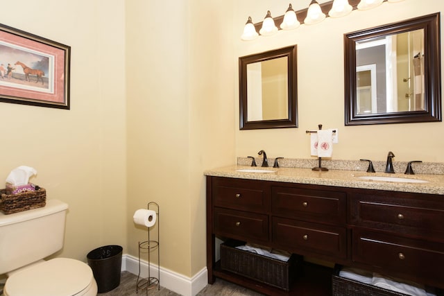 bathroom featuring vanity, toilet, and wood-type flooring