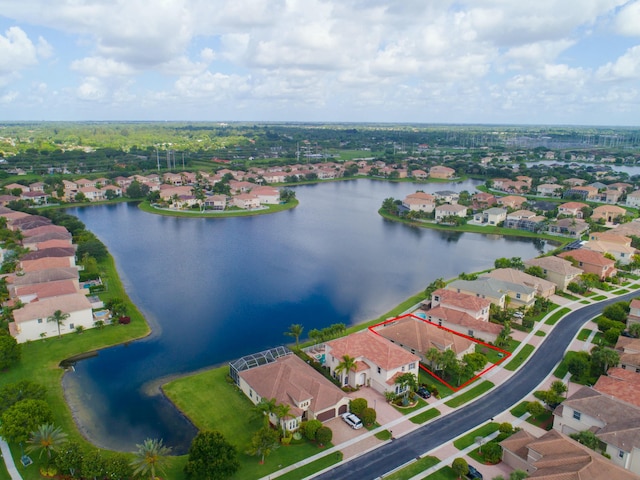 birds eye view of property with a water view